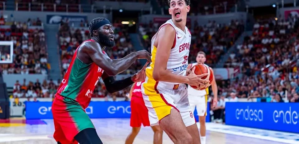 Player from Spain dribbling against opponent in game
