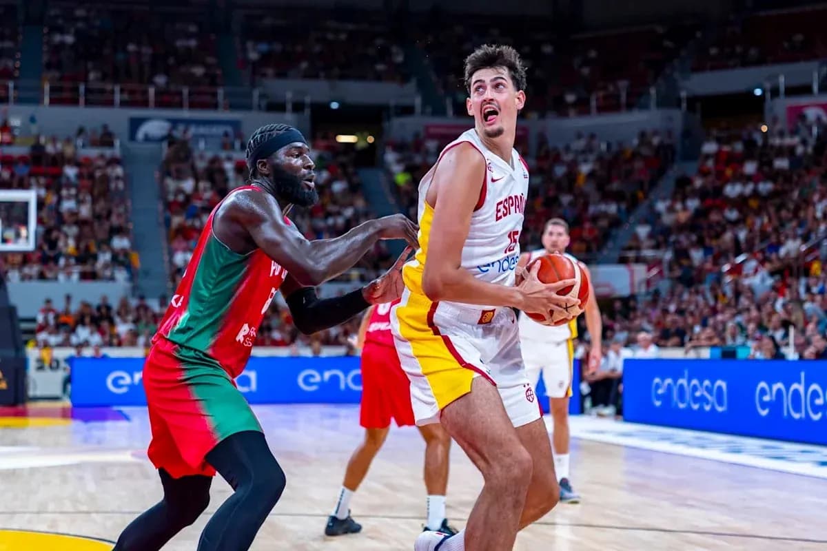Player from Spain dribbling against opponent in game