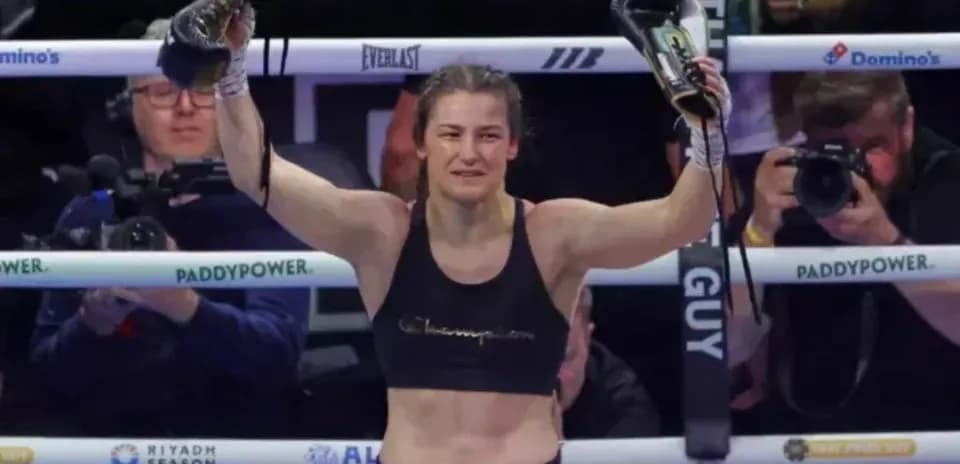 Katie Taylor celebrating victory with gloves raised
