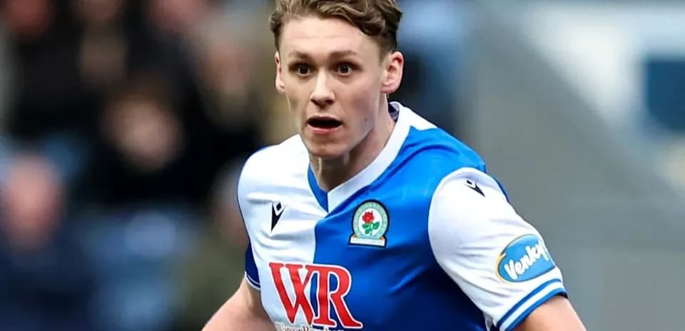 Player in Blackburn Rovers kit running during match