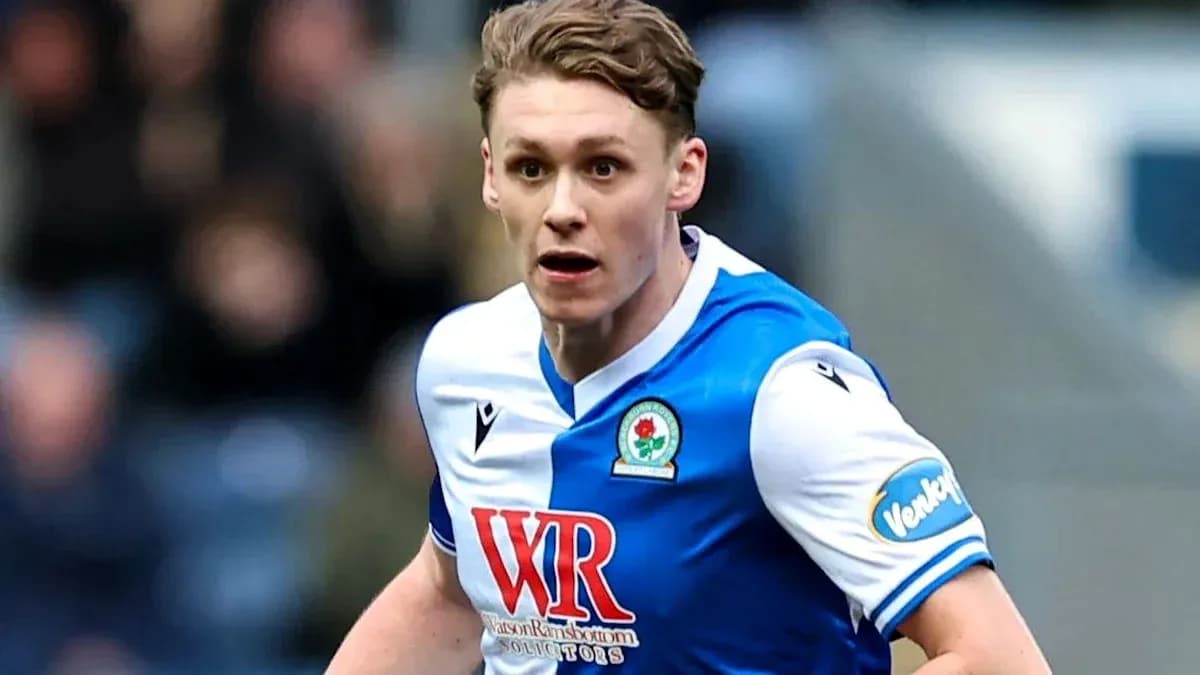 Player in Blackburn Rovers kit running during match