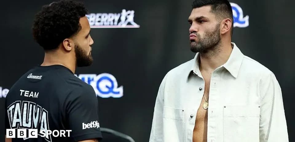Two boxers facing off at press event