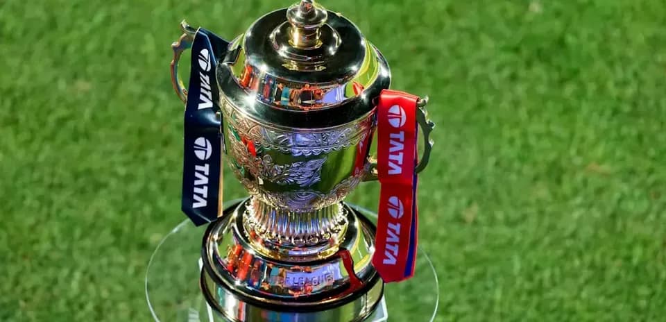 Trophy displayed on glass stand with ribbons