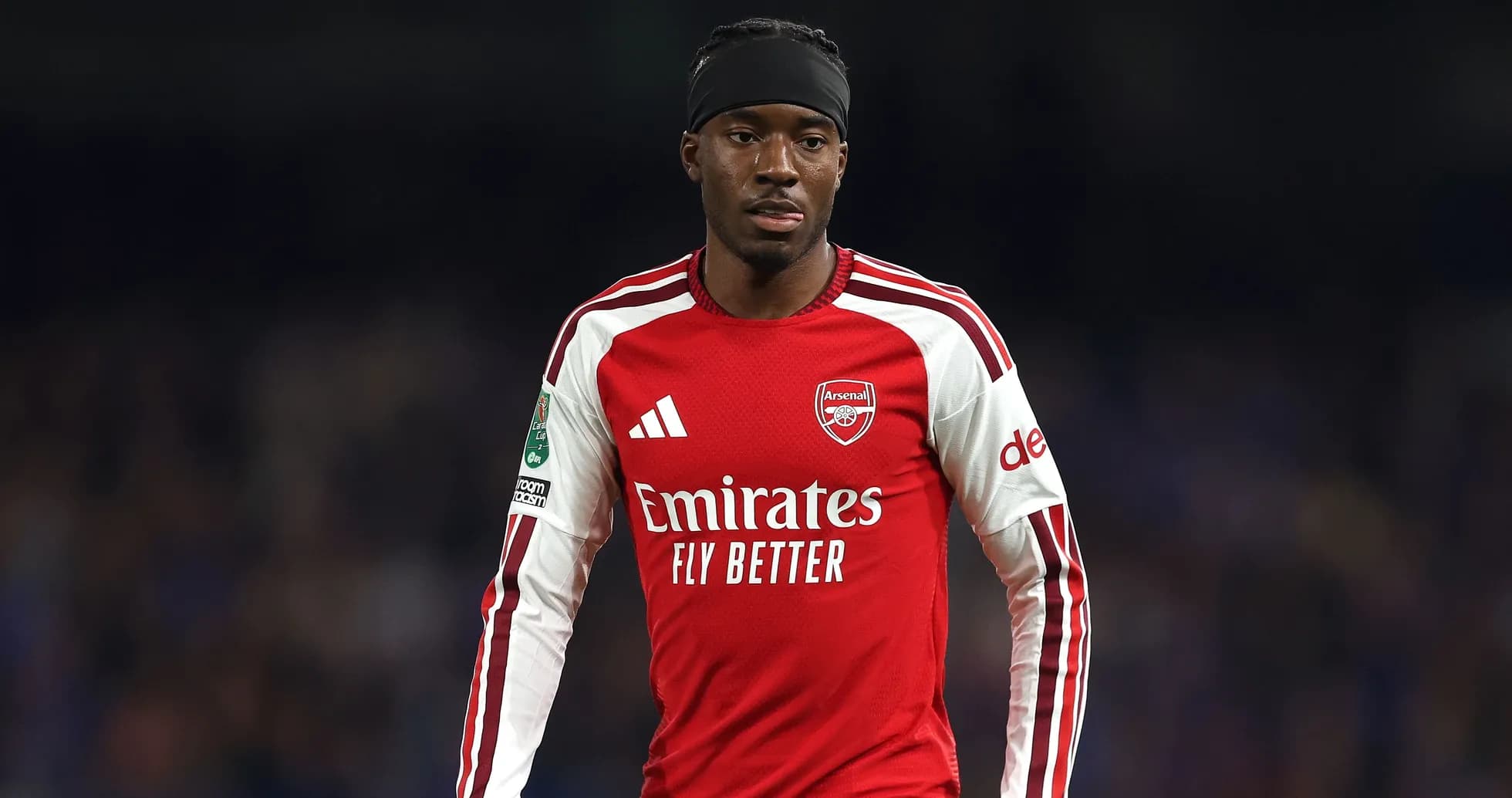 Arsenal player in red jersey during match