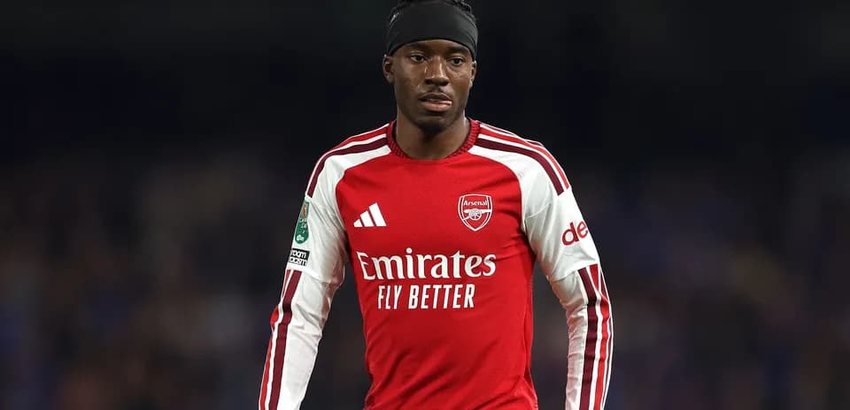 Arsenal player in red jersey during match
