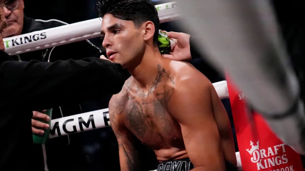 Boxer receiving assistance in the corner of the ring