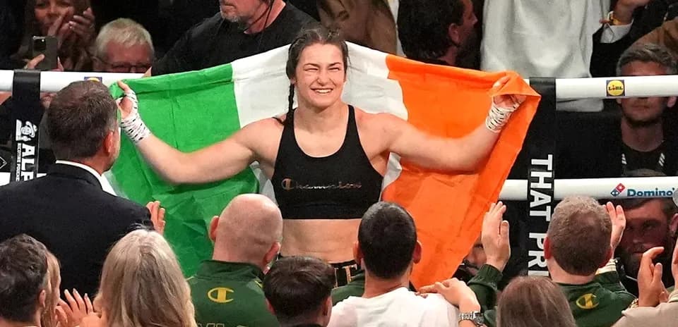 Athlete celebrating with Irish flag after match