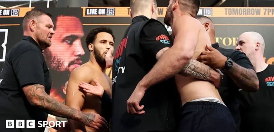 Two boxers face off during weigh-in event
