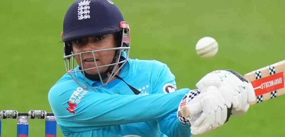 Batter playing a shot during cricket match