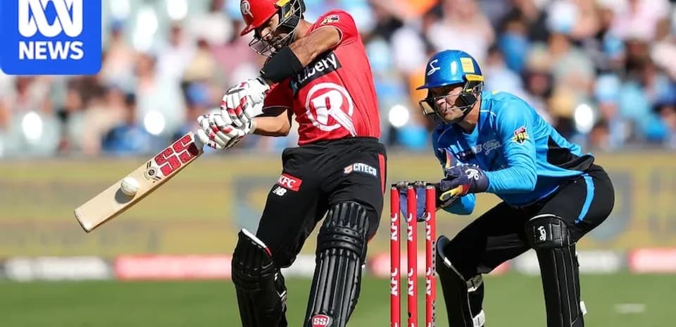 Batter striking the ball with a bat in cricket