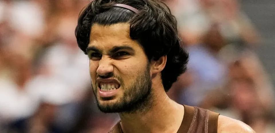 Tennis player celebrating a point during match
