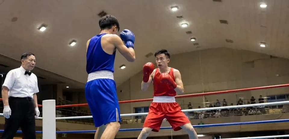 Two boxers competing in a ring during match