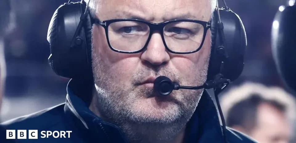 Coach wearing headset during match observation