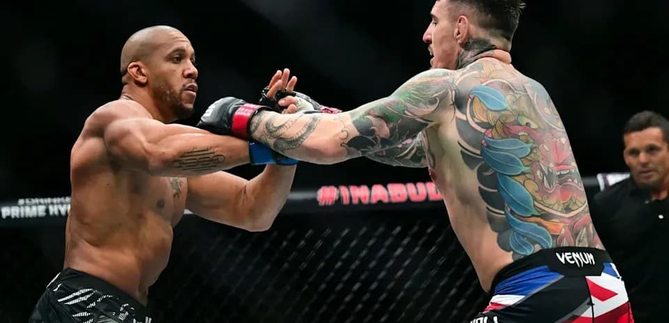 Two fighters exchanging strikes in MMA match