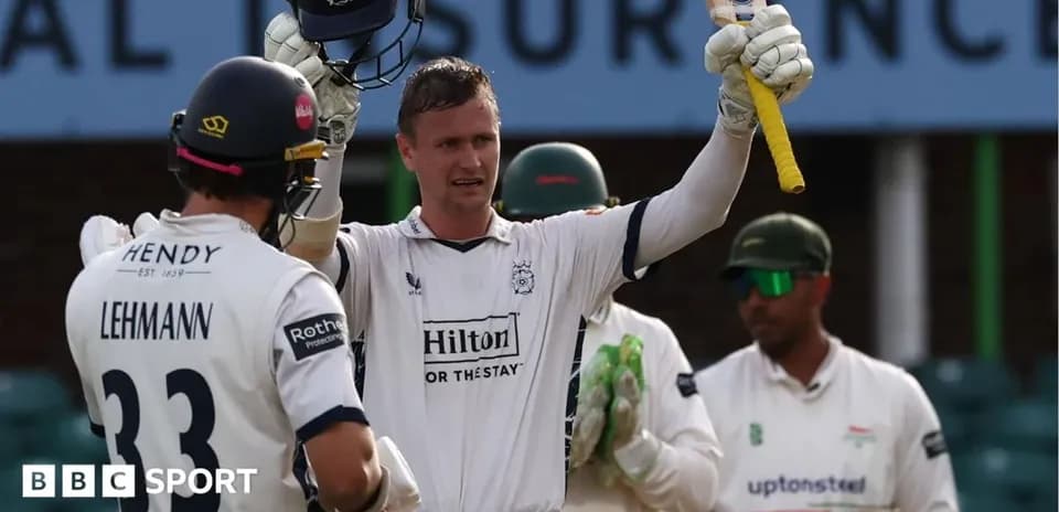 Batsman celebrating a milestone with teammates nearby