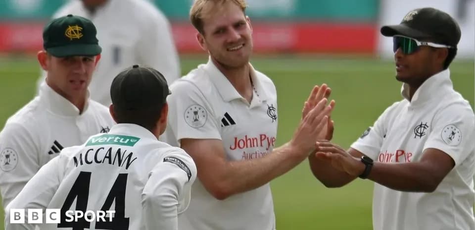 Cricketers celebrating a wicket during a match