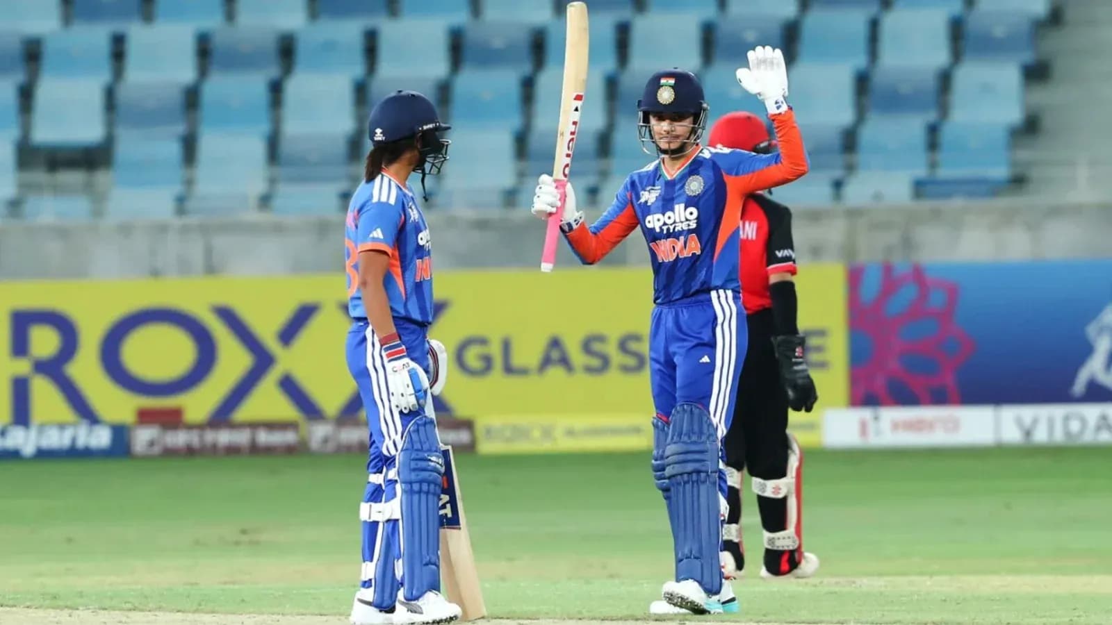 Batsman celebrating after scoring runs in cricket match