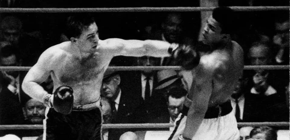 Boxers exchanging punches in the ring during match