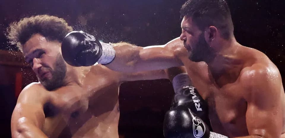Boxers exchanging punches in a boxing match