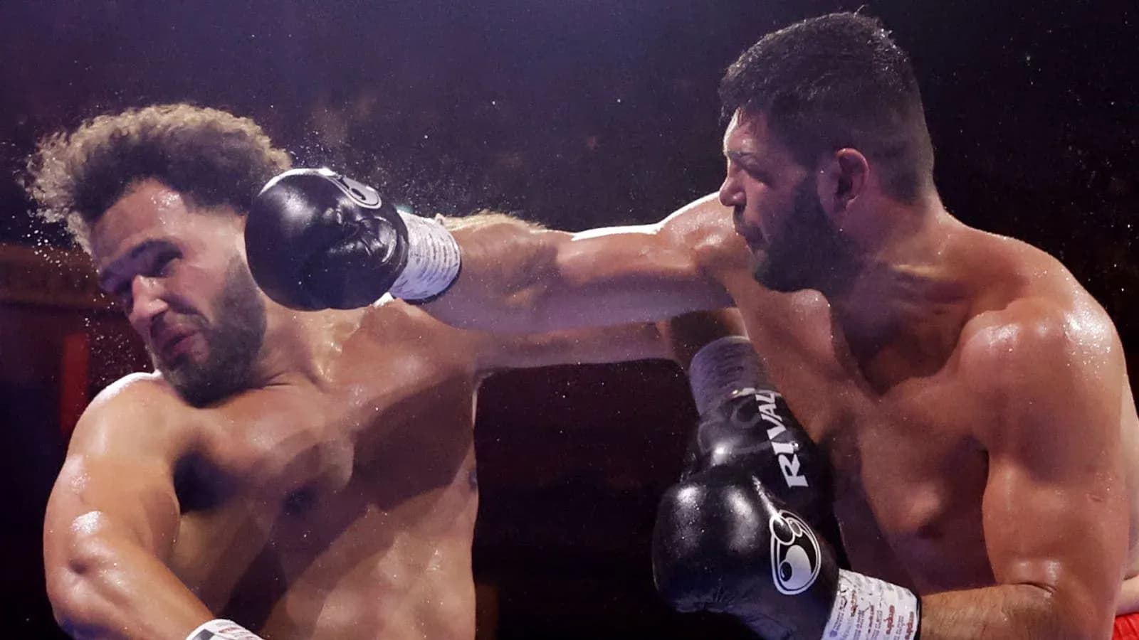 Boxers exchanging punches in a boxing match