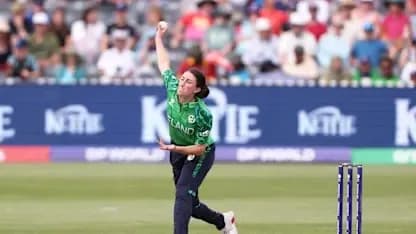 Bowler delivering a ball in cricket match