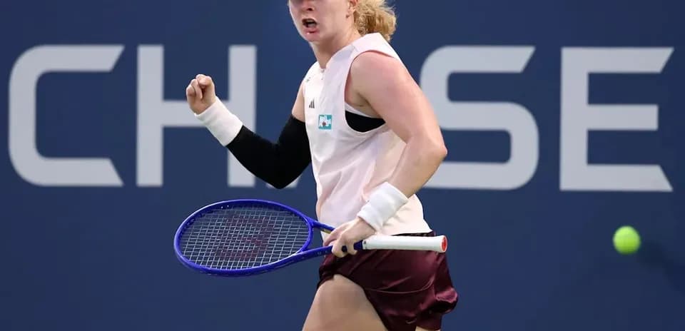 Tennis player celebrating a point during match