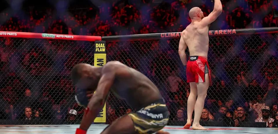 Joe Pyfer celebrating victory in UFC octagon