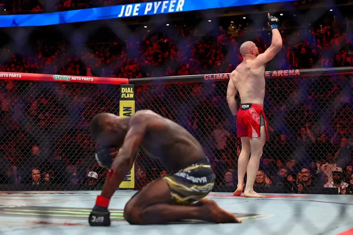 Joe Pyfer celebrating victory in UFC octagon