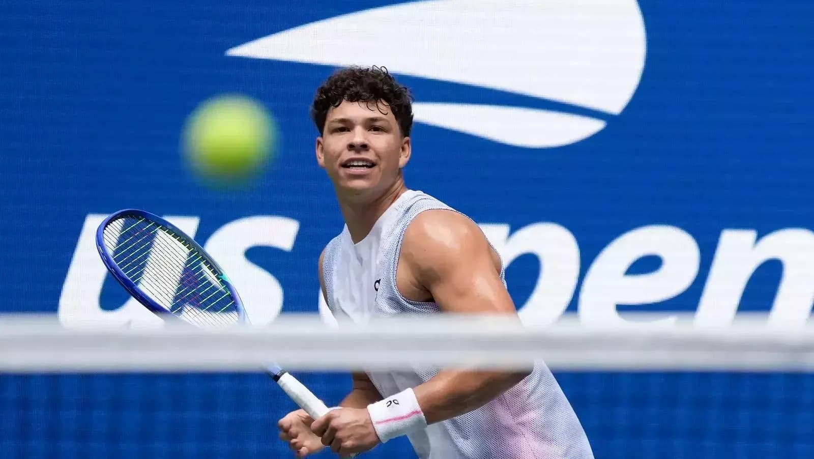 Player preparing to hit a tennis ball at US Open