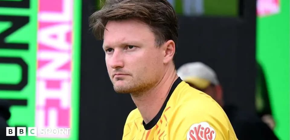 Player sitting on bench during match warm-up