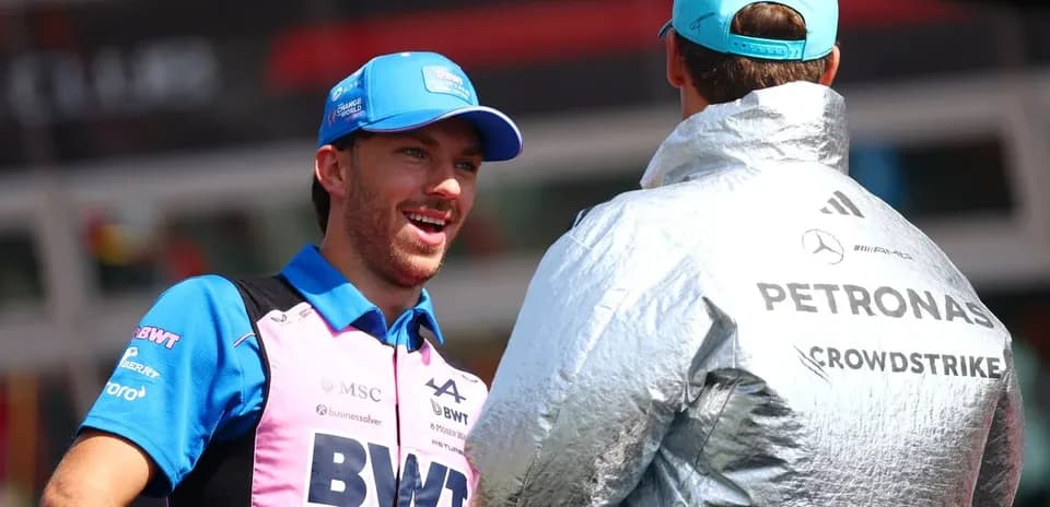 Two drivers talking in pit area before race