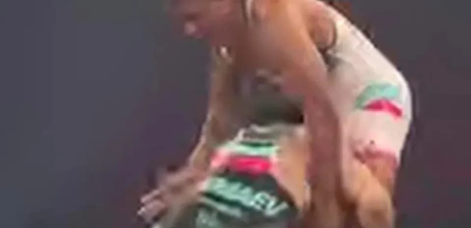 Two wrestlers competing in a match