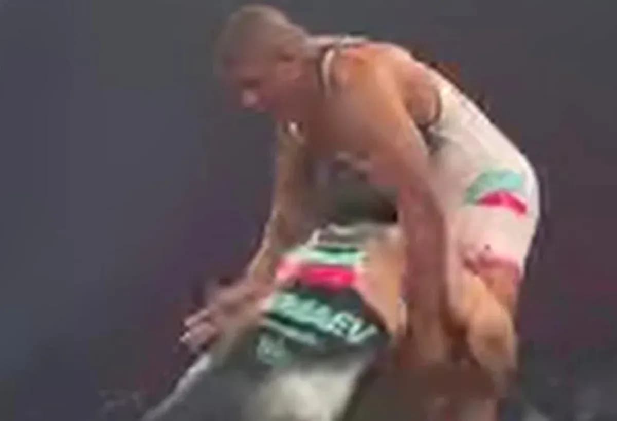 Two wrestlers competing in a match