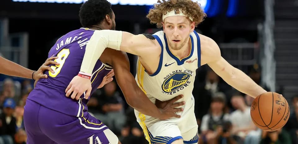 Player dribbling ball while being guarded during game