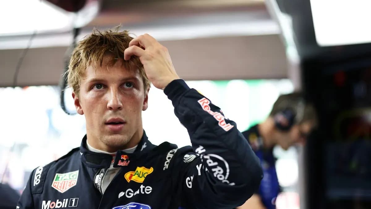 Driver adjusting hair in pit area during event