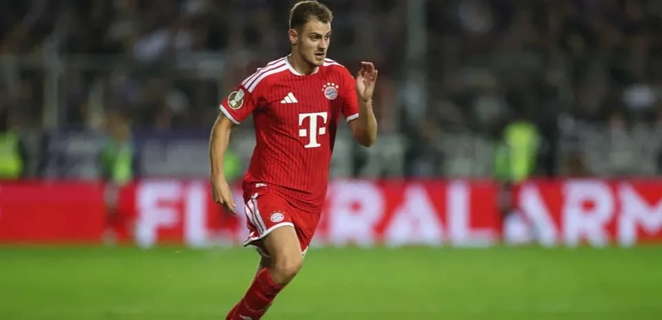 Player in red kit running during match