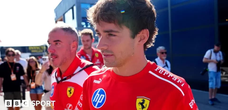 Formula 1 driver in Ferrari team uniform walking