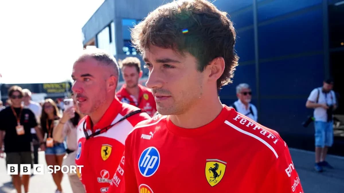 Formula 1 driver in Ferrari team uniform walking