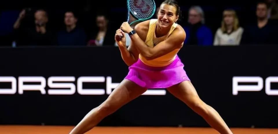 Tennis player hitting a forehand during match