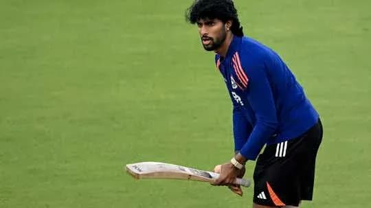 Player practicing with bat on cricket field