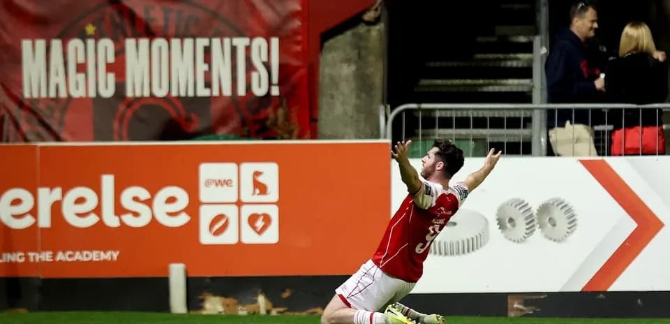 Player celebrating on the field after scoring