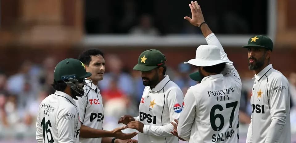 Pakistani cricket players celebrating a wicket on field