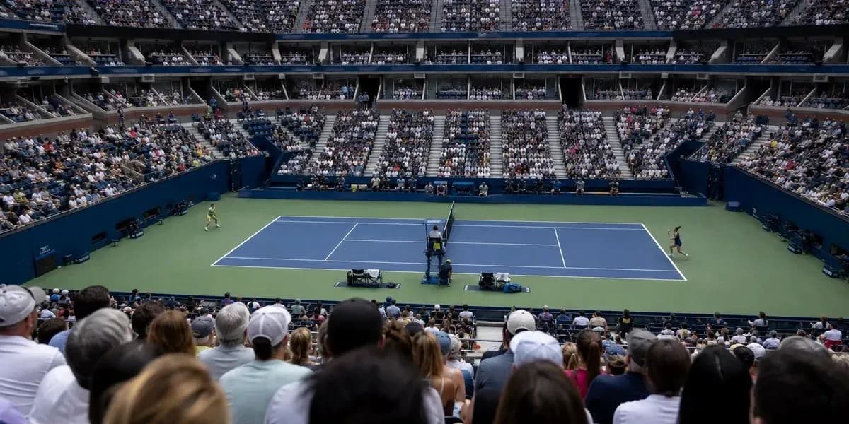 Crowd watching a tennis match at a stadium