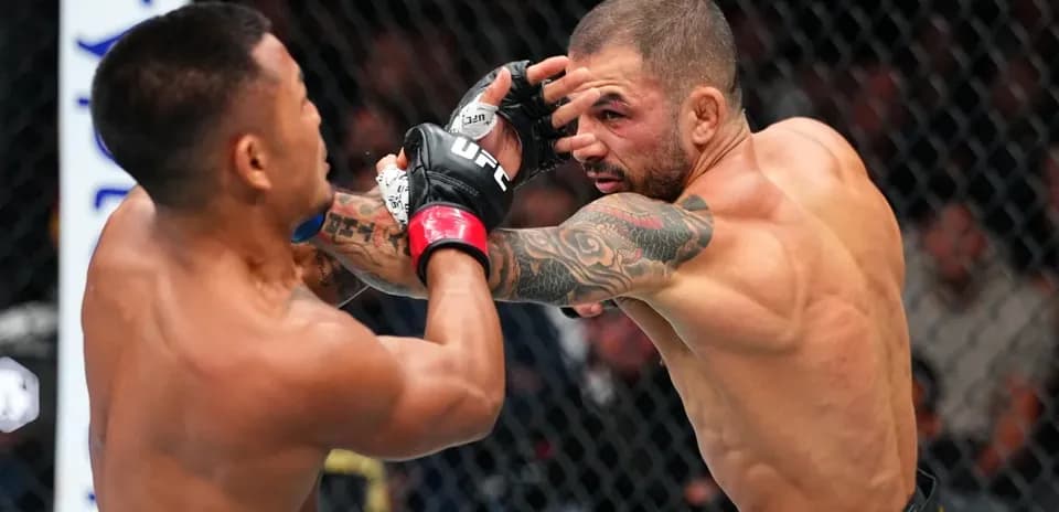 Two fighters exchanging punches in the octagon