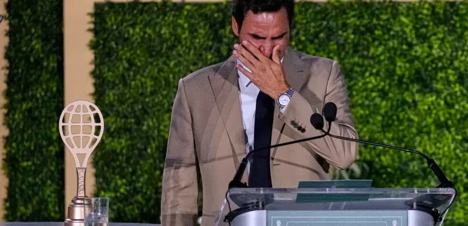 Roger Federer speaking at retirement ceremony podium