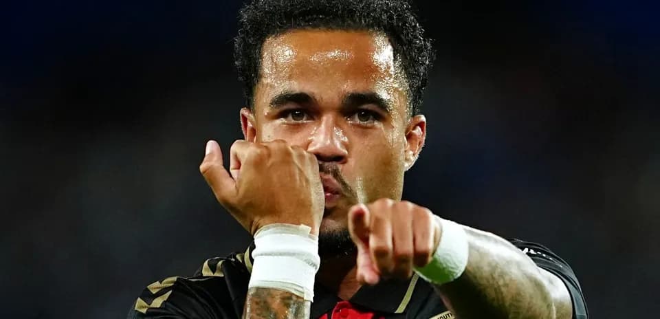 Player celebrating with clenched fists on field