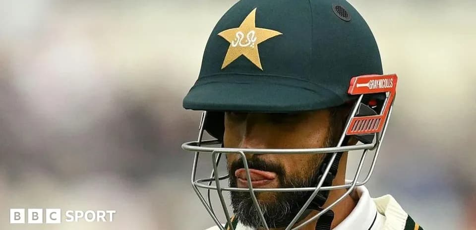 Cricketer wearing helmet with Pakistan logo