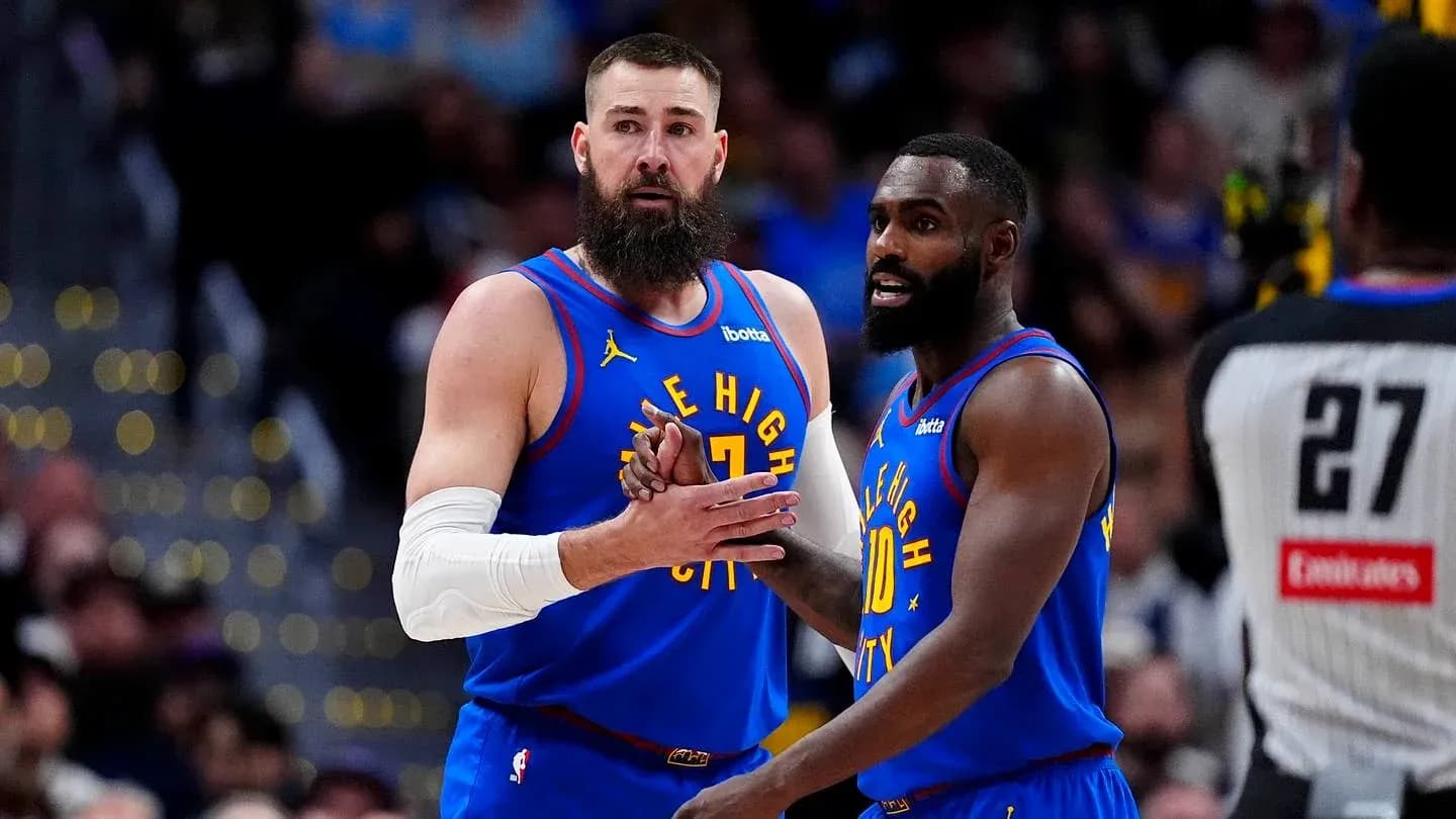 Two players discussing strategy on the court
