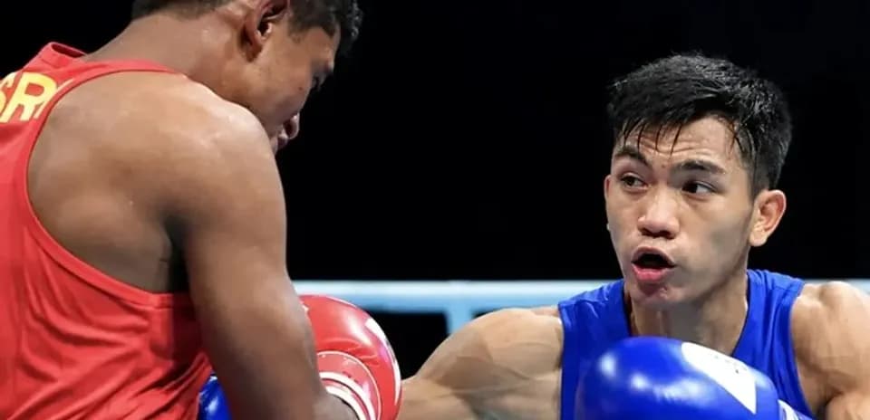 Two boxers competing in a ring during match