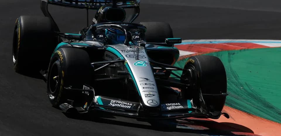 Mercedes Formula 1 car racing on track corner